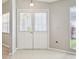 Bright sunroom with white tile floor and wall to wall windows that have white blinds at 4655 Wallingford Ct # 4655, New Port Richey, FL 34655