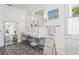 Elegant bathroom featuring double sinks, designer tile flooring, and modern fixtures, creating a spa-like atmosphere at 4913 N Central Ave, Tampa, FL 33603