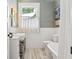 Bright bathroom featuring white subway tile, window, and stylish vanity at 4913 N Central Ave, Tampa, FL 33603
