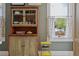 Vintage-style hutch in the kitchen area with a clear view of the backyard through the window at 4913 N Central Ave, Tampa, FL 33603