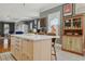Kitchen island with breakfast bar seating and view to the formal dining area and stainless steel appliances at 4913 N Central Ave, Tampa, FL 33603
