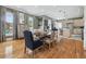 Bright open concept living and dining area featuring hardwood floors and neutral paint palette at 4913 N Central Ave, Tampa, FL 33603