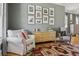 Comfortable living room featuring hardwood floors, stylish decor, and ample natural light, creating an inviting atmosphere at 4913 N Central Ave, Tampa, FL 33603