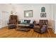 Relaxing living room featuring hardwood floors, stylish furniture, and a cozy atmosphere at 4913 N Central Ave, Tampa, FL 33603