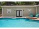 A luxurious pool features a hot tub and outdoor access to the home's interior at 4913 N Central Ave, Tampa, FL 33603