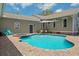Stunning pool area with comfortable seating and lush landscaping at 4913 N Central Ave, Tampa, FL 33603
