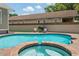 Backyard featuring a pool, hot tub, grill and outdoor seating at 4913 N Central Ave, Tampa, FL 33603