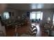 Cozy living room featuring a comfortable sofa, stylish furnishings, and seamless flow into the adjacent office space at 51 Lexington Ct # 13, Palm Harbor, FL 34684