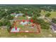A high-angle view of the property shows the home, structures, and a red line marking the boundaries at 5109 Horton Rd, Plant City, FL 33567