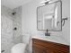 Contemporary bathroom with marbled shower and wooden vanity at 5109 Horton Rd, Plant City, FL 33567