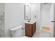 Stylish bathroom with modern vanity, black fixtures, and white marble flooring at 5109 Horton Rd, Plant City, FL 33567