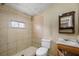 Bathroom with a vanity and a toilet next to a tiled shower area at 5109 Horton Rd, Plant City, FL 33567