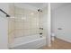 Bathroom features a tiled shower over tub, toilet, and fixtures at 5109 Horton Rd, Plant City, FL 33567