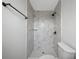 Elegant bathroom shower featuring marble tiling and black fixtures at 5109 Horton Rd, Plant City, FL 33567