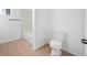 Clean bathroom with a toilet, shower/tub, and tile flooring at 5109 Horton Rd, Plant City, FL 33567