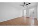This bedroom has tile flooring, white walls, and a ceiling fan, creating a cool and comfortable retreat at 5109 Horton Rd, Plant City, FL 33567