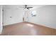 Bedroom featuring neutral tile, ceiling fan, and multiple doorways at 5109 Horton Rd, Plant City, FL 33567