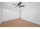 Bedroom features include tile flooring, neutral paint, ceiling fan, and large closet at 5109 Horton Rd, Plant City, FL 33567