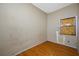 Bedroom with wood-look floor and a boarded window at 5109 Horton Rd, Plant City, FL 33567
