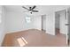 Bright bedroom featuring tiled floors, a ceiling fan, and closet at 5109 Horton Rd, Plant City, FL 33567