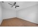 Neutral bedroom with tile flooring features a ceiling fan at 5109 Horton Rd, Plant City, FL 33567