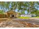 Charming home with a front porch, mature trees, and a large yard needing TLC at 5109 Horton Rd, Plant City, FL 33567