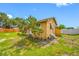 This image of the home shows the backyard with a tree near the home at 5109 Horton Rd, Plant City, FL 33567