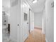 Bright hallway with tiled floors leading to a modern bathroom with marble accents at 5109 Horton Rd, Plant City, FL 33567