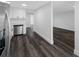 Updated kitchen features stainless steel appliances, sleek white cabinets, and dark-colored floors at 5109 Horton Rd, Plant City, FL 33567