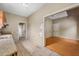 A kitchen with damaged floors looks into another room at 5109 Horton Rd, Plant City, FL 33567