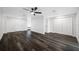 Spacious living room featuring modern flooring, a ceiling fan, and lots of natural light at 5109 Horton Rd, Plant City, FL 33567