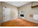 Empty room with wood floor, a door, and a window offering a blank canvas for customization at 5109 Horton Rd, Plant City, FL 33567