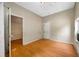 Empty room features wood-look flooring, neutral walls and a closed door at 5109 Horton Rd, Plant City, FL 33567