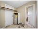 Utility room, tile flooring, water heater and access to other rooms at 5109 Horton Rd, Plant City, FL 33567