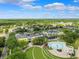 Aerial shot of the town center with fountain, green space and nearby homes at 5314 Alafia Falls Dr, Lithia, FL 33547