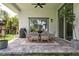 Open air back porch features a dining table with six seats and a grill at 5314 Alafia Falls Dr, Lithia, FL 33547