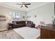Comfortable living room with a brown sectional sofa, wood flooring and natural light at 5314 Alafia Falls Dr, Lithia, FL 33547