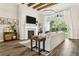Cozy living room with a fireplace, large windows, and comfortable seating creating a relaxing ambiance at 5314 Alafia Falls Dr, Lithia, FL 33547