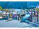 Community playground with colorful play structures and a soft, safe surface at 5314 Alafia Falls Dr, Lithia, FL 33547