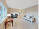 Inviting living room featuring a piano, white sofa, and stylish decor, perfect for relaxation and entertainment at 6067 43Rd N Ter, Kenneth City, FL 33709