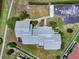 Aerial shot of the property showcasing the roof, landscaping, and surrounding green space with walking path at 609 Lively Dr # B, Sun City Center, FL 33573