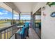 Relaxing screened balcony with comfortable seating overlooking a peaceful lake view at 609 Lively Dr # B, Sun City Center, FL 33573
