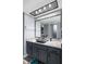 Bathroom boasts a unique glass bowl sink, modern fixtures, and a stylish mirror over granite countertops at 609 Lively Dr # B, Sun City Center, FL 33573