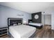 Comfortable bedroom featuring wood flooring, two beds, modern decor, and closet space for ample storage at 609 Lively Dr # B, Sun City Center, FL 33573