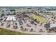 Aerial view of the community center lawn bowling fields, shuffleboard courts, and pool at 609 Lively Dr # B, Sun City Center, FL 33573
