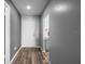Inviting entryway with modern flooring and a view into the kitchen area offering a warm welcome at 609 Lively Dr # B, Sun City Center, FL 33573