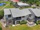 A charming condo featuring screened lanais, lush landscaping and gray shingle roof at 609 Lively Dr # B, Sun City Center, FL 33573