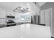 Spacious kitchen featuring stainless steel appliances, gray cabinets, and white marble countertops at 609 Lively Dr # B, Sun City Center, FL 33573