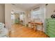 Bright bedroom featuring mirrored closet doors, hardwood floors, and natural light at 6114 7Th S Ave, Gulfport, FL 33707