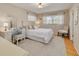 Bright bedroom with hardwood floors, neutral walls and a charming vanity area at 6114 7Th S Ave, Gulfport, FL 33707